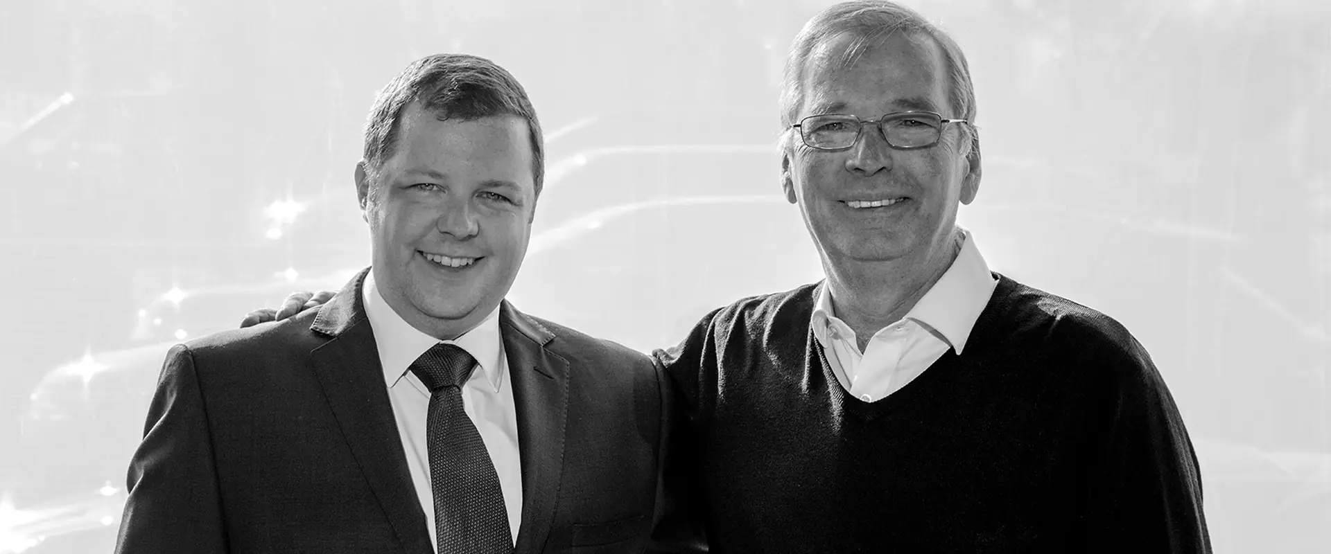 James Lewis and Jim Lewis, the family behind JLC, photographed in black and white