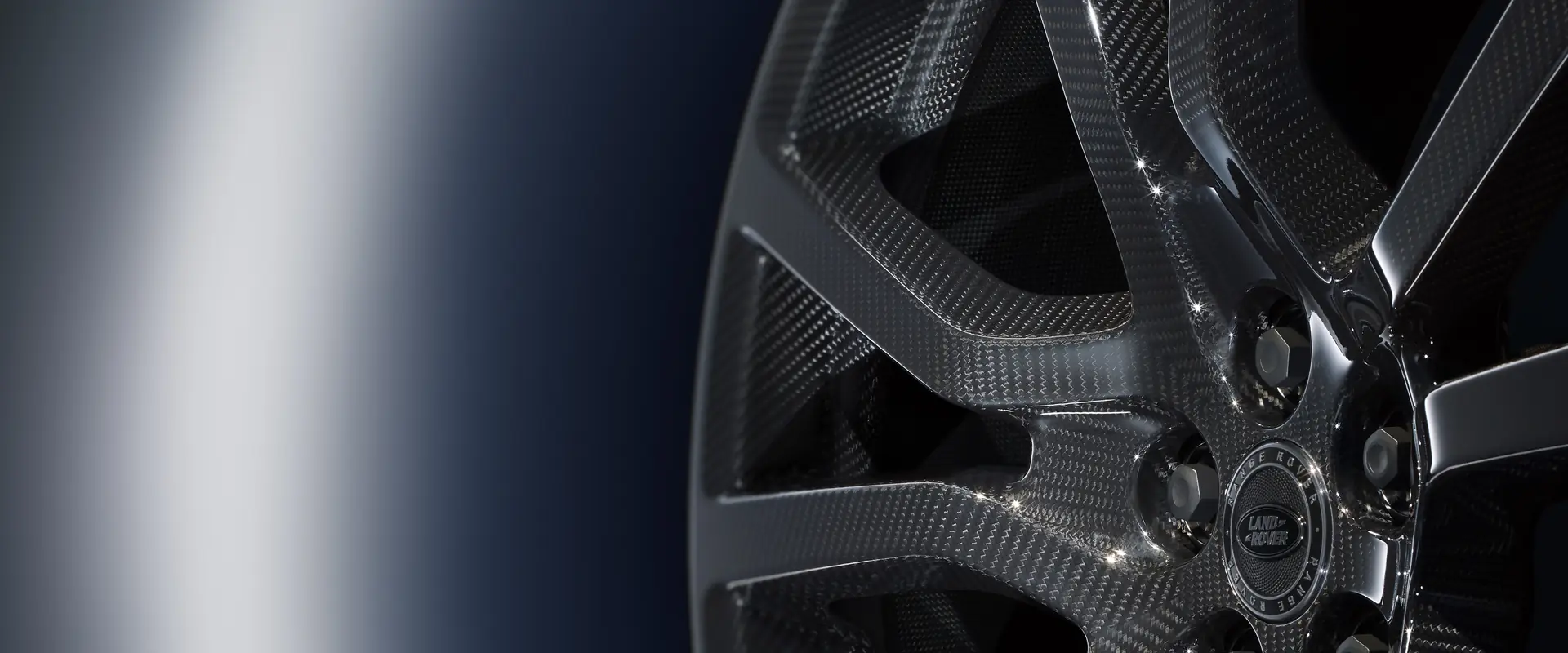 Close-up of a genuine Range Rover carbon fibre alloy wheel, one of the accessories JLC supplies and fits